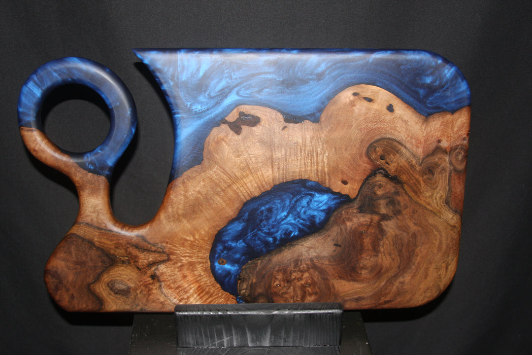 Highly figured Old English walnut with deep blueblood epoxy resin charcuterie board