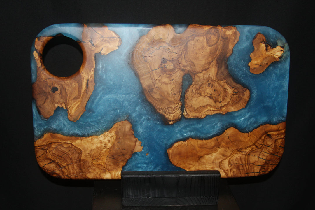 Ancient olivewood slices with ocean blue epoxy resin charcuterie board