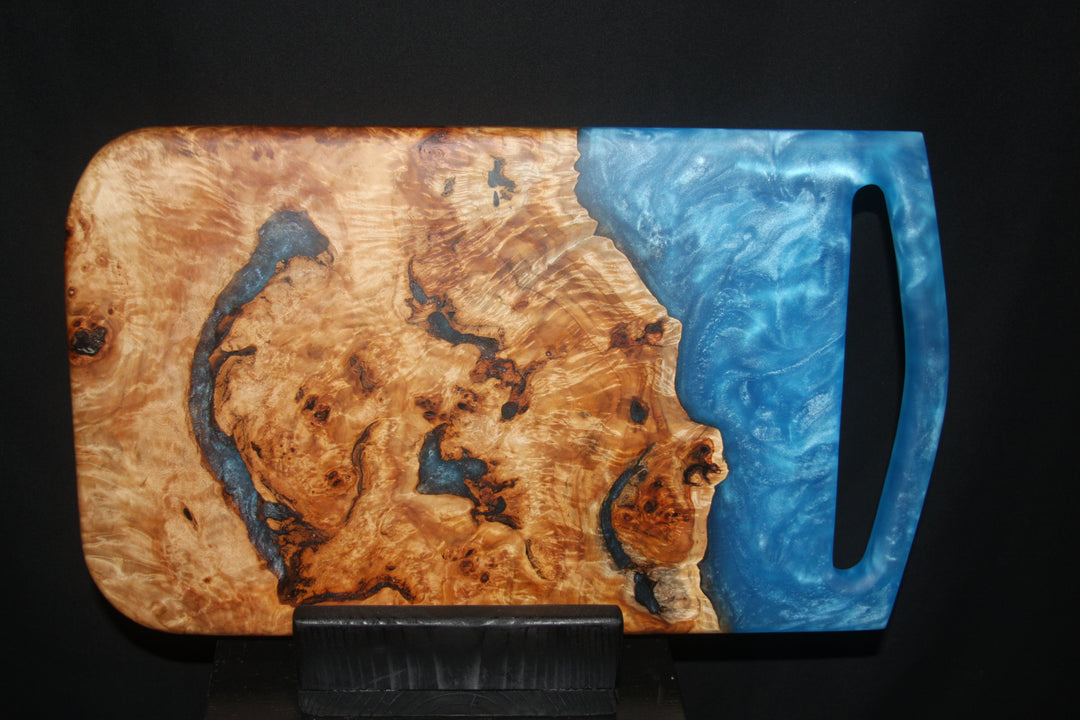 Mappa burl with ocean blue swirling epoxy resin charcuterie board