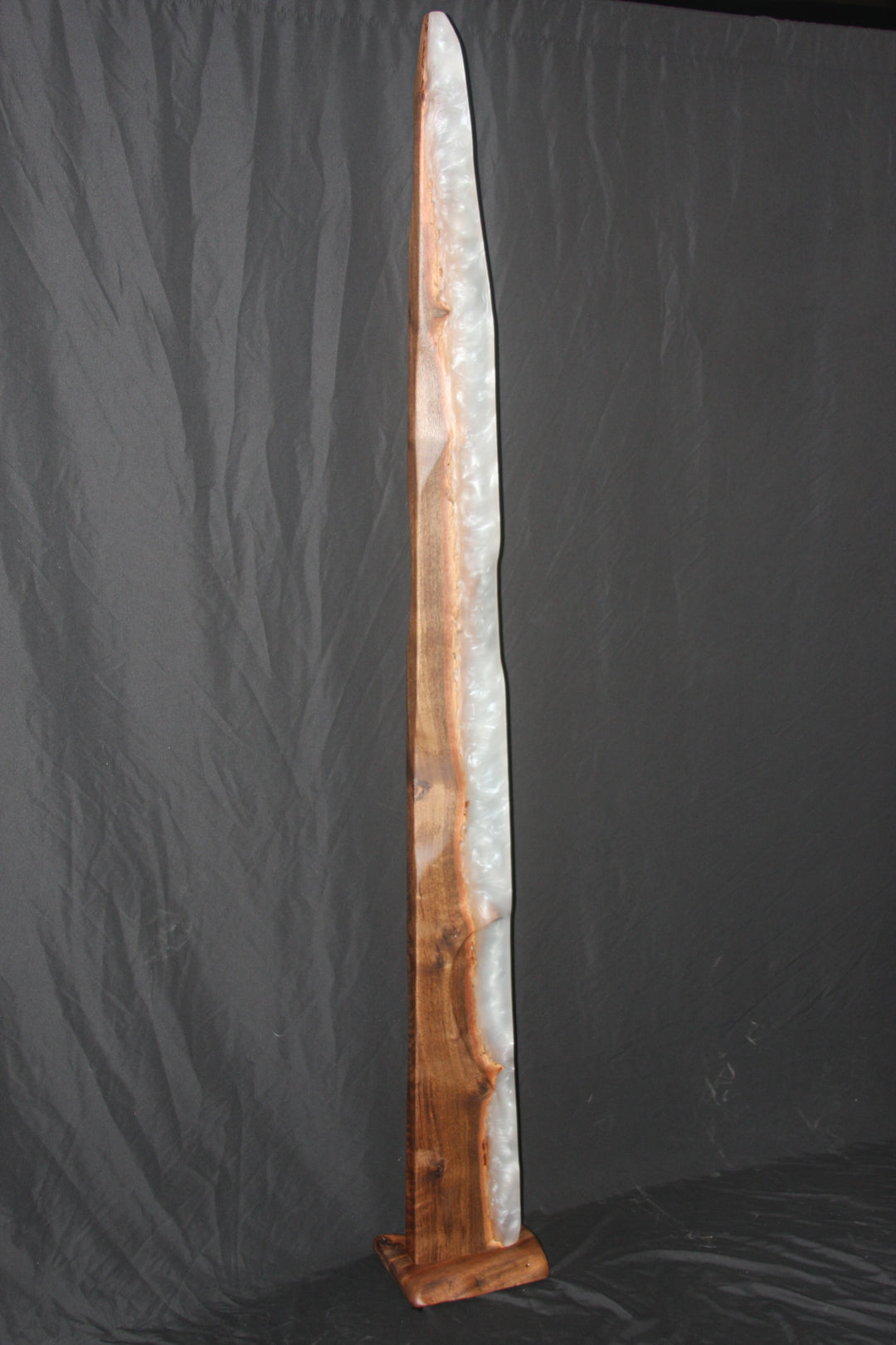 Live edge claro walnut with cloudy white spire sculpture